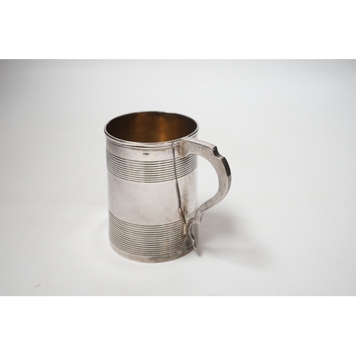 1855 - A George III reeded silver christening mug, Stephen Adam I, London, 1801, 85mm.