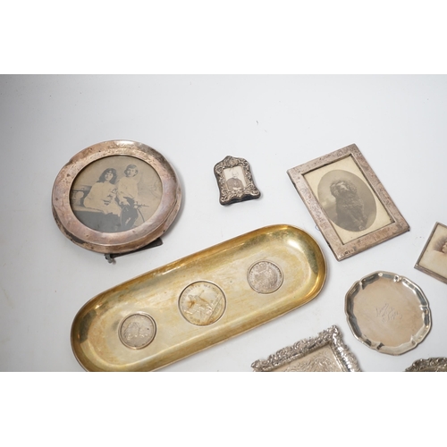 1856 - Sundry small silver and white metal items including seven photograph frames, largest 12.5cm, an 800 ... 