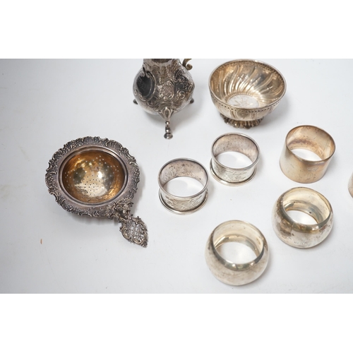 1857 - Sundry silver including six silver napkin rings, an 800 standard tea strainer and a white metal bowl... 