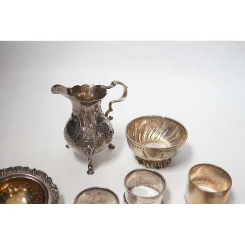 1857 - Sundry silver including six silver napkin rings, an 800 standard tea strainer and a white metal bowl... 