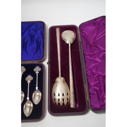 1862 - A cased pair of Victorian aesthetic period silver salad servers, Atkin Brothers, Sheffield, 1881 and... 