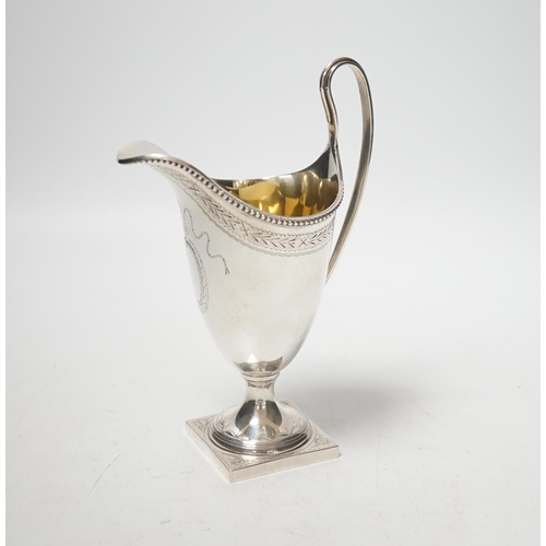 1873 - A modern George III style helmet shaped cream jug, on square base, C.J. Vander Ltd, London, 1972, 16... 