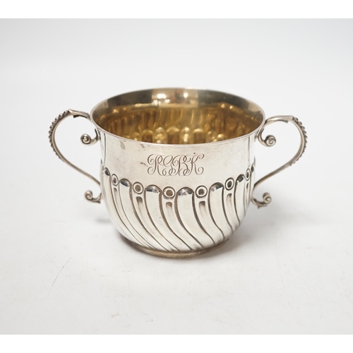 1874 - A late Victorian embossed silver porringer, Robert Stebbings, London, 1890, height 7cm, 4.9oz.... 