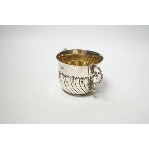 1874 - A late Victorian embossed silver porringer, Robert Stebbings, London, 1890, height 7cm, 4.9oz.... 