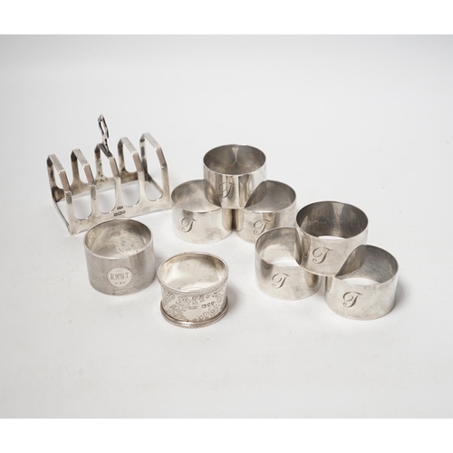 1875 - A set of six silver napkin rings, Robert Pringle & Sons, London, 1953, two other silver napkin rings... 