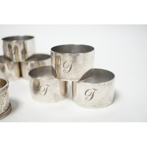 1875 - A set of six silver napkin rings, Robert Pringle & Sons, London, 1953, two other silver napkin rings... 