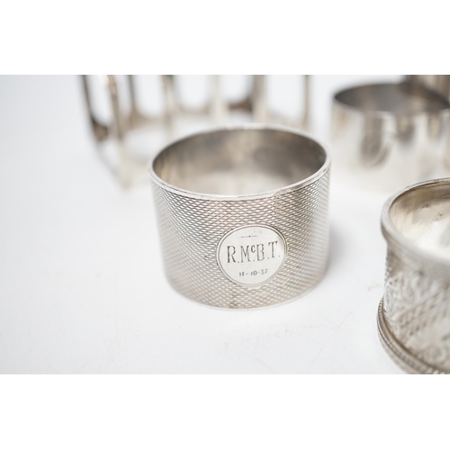 1875 - A set of six silver napkin rings, Robert Pringle & Sons, London, 1953, two other silver napkin rings... 