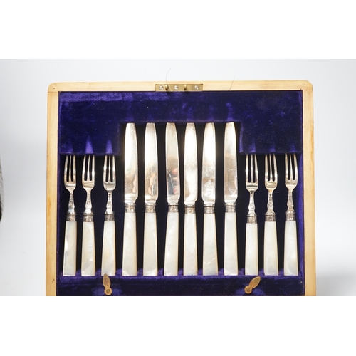 1881 - An Edwardian cased set of twelve pairs of silver and mother of pearl handled dessert eaters, Frederi... 