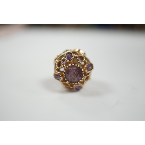 1928 - A modern 9ct gold, amethyst and peridot set pendant, or pierced spherical form, 25mm, gross weight 7... 