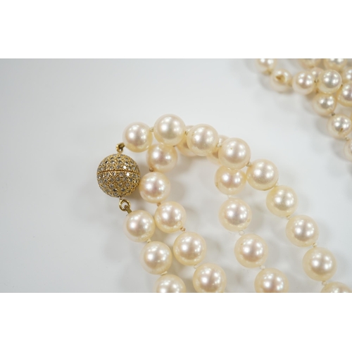 1934 - A single strand cultured pearl necklace, with diamond chip set 18ct gold clasp, 74cm and similar bra... 