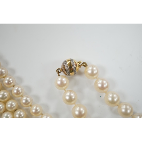 1934 - A single strand cultured pearl necklace, with diamond chip set 18ct gold clasp, 74cm and similar bra... 