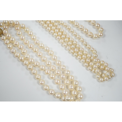 1934 - A single strand cultured pearl necklace, with diamond chip set 18ct gold clasp, 74cm and similar bra... 