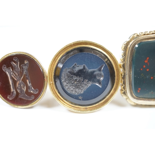 1943 - Three assorted Victorian and later yellow metal overlaid and chalcedony set fob deals, including int... 