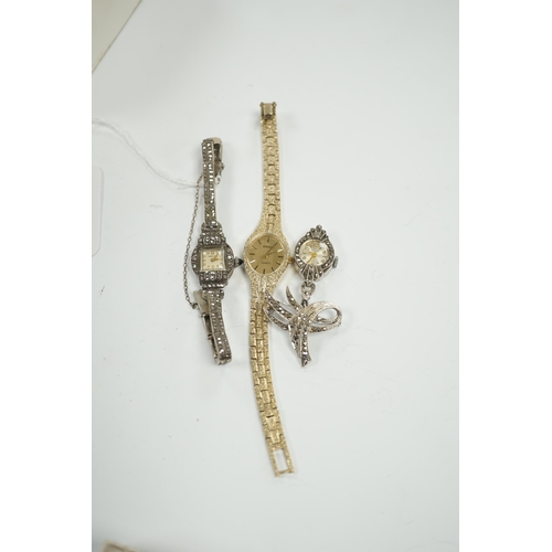 1954 - A late 1950's silver and marcasite set Premex manual wind cocktail watch, a similar lapel watch and ... 