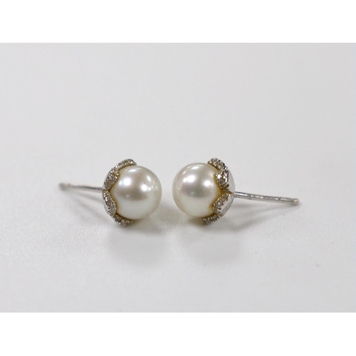 1964 - A pair of 18ct white gold, cultured pearl and diamond chip set ear studs, pearl diameter 8.15mm, gro... 