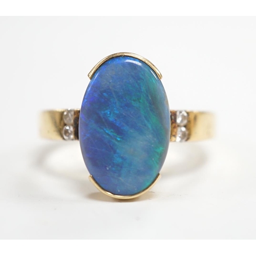 1965 - A yellow metal and black opal oval dress ring, with diamond chip shoulders, size P, gross weight 5.7... 