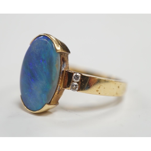 1965 - A yellow metal and black opal oval dress ring, with diamond chip shoulders, size P, gross weight 5.7... 