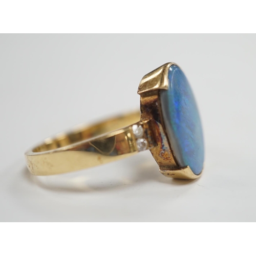 1965 - A yellow metal and black opal oval dress ring, with diamond chip shoulders, size P, gross weight 5.7... 