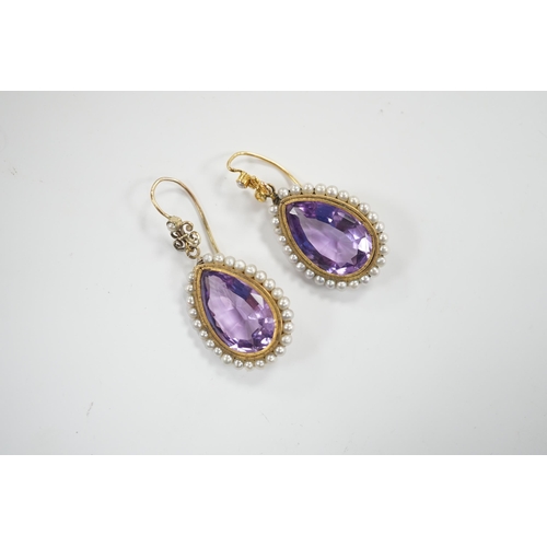 1968 - A pair of Victorian yellow metal, amethyst and seed pearl set teardrop shaped drop earrings, 21mm, g... 