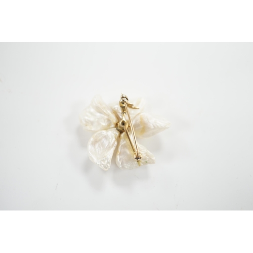 1992 - A yellow metal mounted baroque pearl and single stone diamond set flower head brooch, 30mm, gross we... 