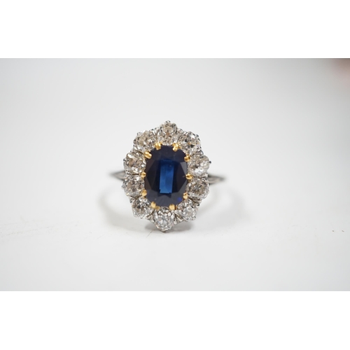 1994 - A white metal, synthetic sapphire and diamond set oval cluster ring, size M, gross weight 3.8 grams.... 