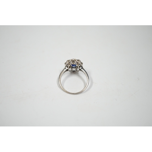 1994 - A white metal, synthetic sapphire and diamond set oval cluster ring, size M, gross weight 3.8 grams.... 