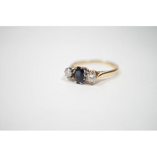 1995 - An 18ct, sapphire and diamond set three stone ring, size N, gross weight 2.8 grams.