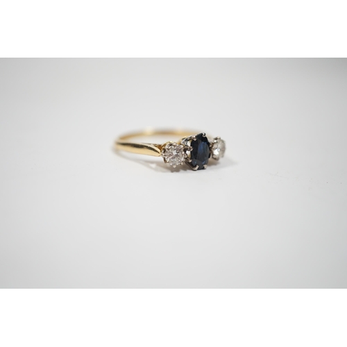 1995 - An 18ct, sapphire and diamond set three stone ring, size N, gross weight 2.8 grams.