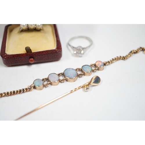 1997 - A yellow metal and graduated five stone oval white opal set bracelet, 16.5cm, a yellow metal opal an... 