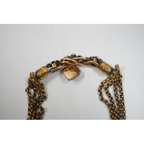 2003 - An antique yellow metal (test as 18ct) and rose cut diamond set triple strand bracelet, the central ... 