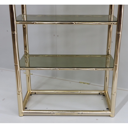 1007 - A Maison Jansen style faux bamboo brass and smoked glass five tier shelf unit, width 76cm, depth 39c... 