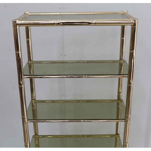 1007 - A Maison Jansen style faux bamboo brass and smoked glass five tier shelf unit, width 76cm, depth 39c... 