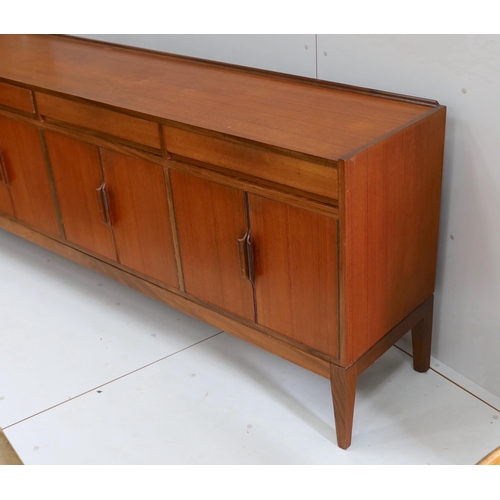 1042 - Robert Heritage for Archie Shine, a mid century teak sideboard, length 238cm, depth 46cm, height 86c... 