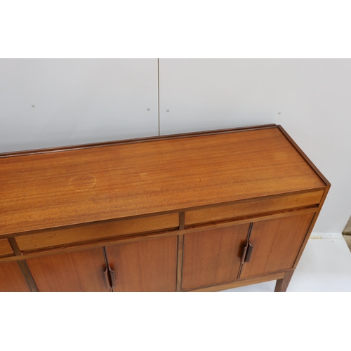 1042 - Robert Heritage for Archie Shine, a mid century teak sideboard, length 238cm, depth 46cm, height 86c... 