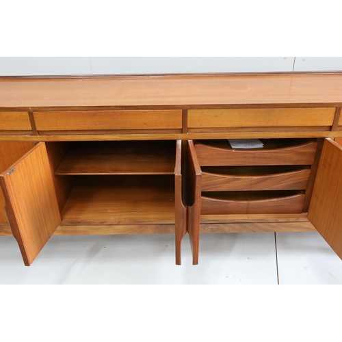 1042 - Robert Heritage for Archie Shine, a mid century teak sideboard, length 238cm, depth 46cm, height 86c... 