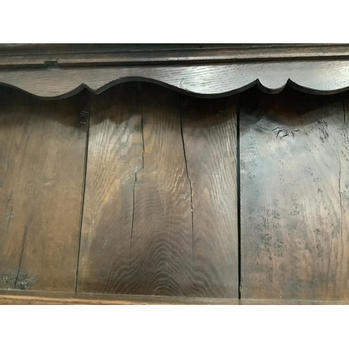 1092 - An 18th century boarded oak plate rack, width 163cm, height 82cm