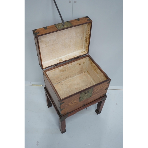 1103 - A Chinese brass mounted elm box on stand, width 42cm, depth 31cm, height 59cm