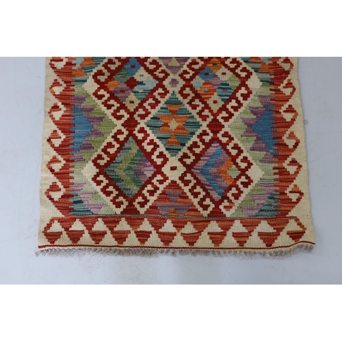 1106 - An Anatolian Kilim polychrome rug, 100 x 78cm