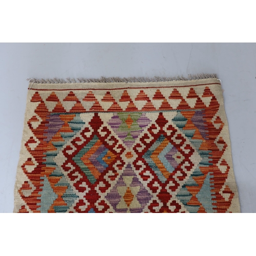 1106 - An Anatolian Kilim polychrome rug, 100 x 78cm