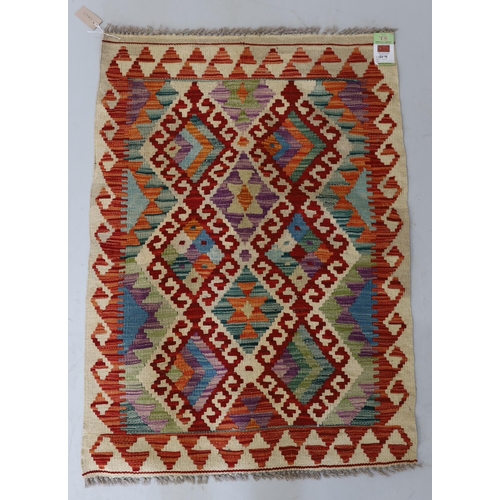 1106 - An Anatolian Kilim polychrome rug, 100 x 78cm