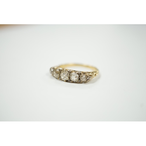 2020 - An early 20th century yellow metal and graduated five stone diamond set half hoop ring, with diamond... 