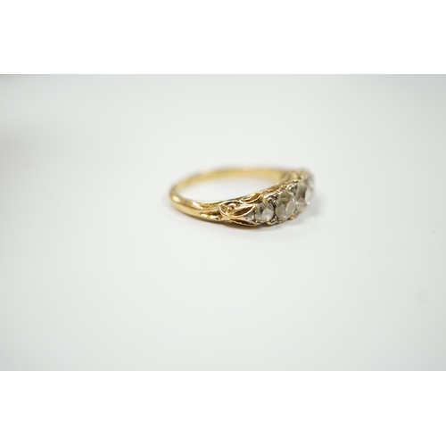 2020 - An early 20th century yellow metal and graduated five stone diamond set half hoop ring, with diamond... 