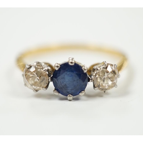 2021 - A yellow metal, single stone sapphire and two stone diamond set ring, size N/O, gross weight 2.2 gra... 