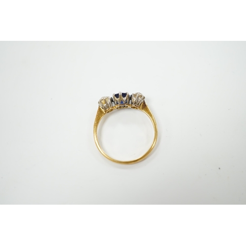 2021 - A yellow metal, single stone sapphire and two stone diamond set ring, size N/O, gross weight 2.2 gra... 