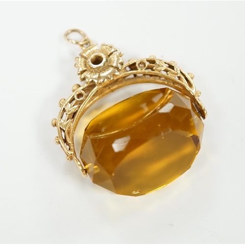 2023 - A 9ct and citrine coloured paste set swivelling fob, 30mm, gross weight 14.7 grams.