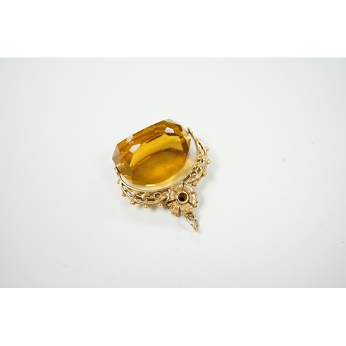 2023 - A 9ct and citrine coloured paste set swivelling fob, 30mm, gross weight 14.7 grams.