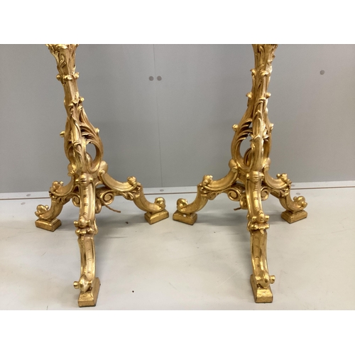 103 - A pair of 18th century style carved gilt cluster column tripod standard lamps, height including shad... 