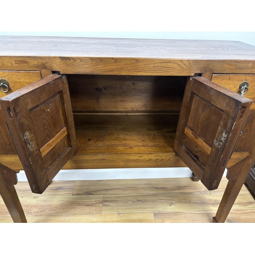 112 - A Chinese elm jumu cabinet, width 128cm, depth 44cm, height 107cm