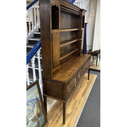 121 - An 18th century oak dresser with boarded rack, width 182cm, depth 45cm, height 211cm