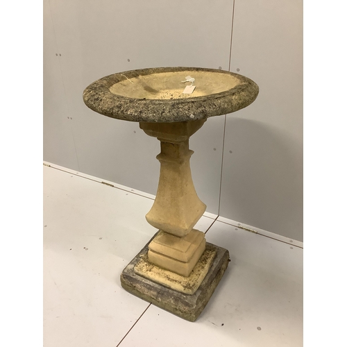 147 - A circular stone bird bath on square plinth, diameter 58cm, height 95cm.